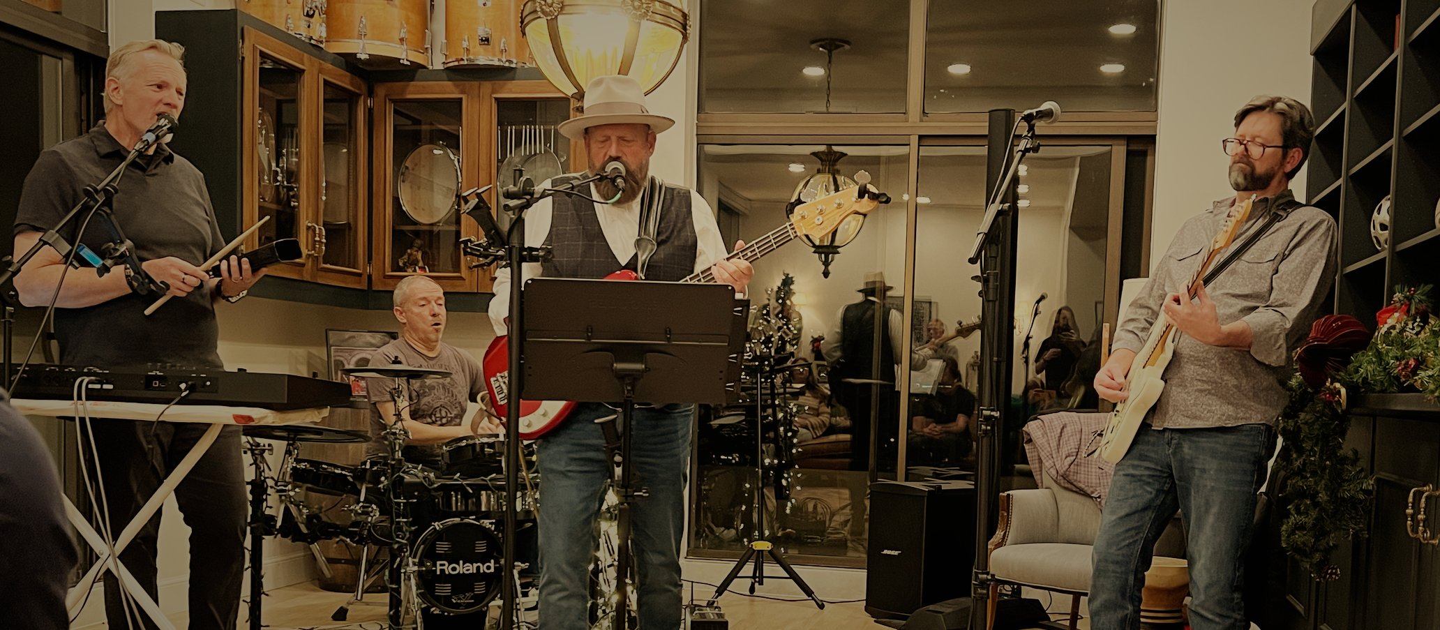Roadhouse Revival playing live: Evan on keys, Tom on drums, Dave singing on bass, Matt on guitar.